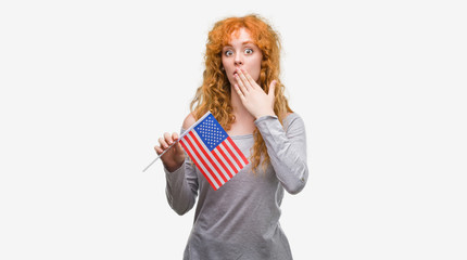 Sticker - Young redhead woman holding flag of United States of America cover mouth with hand shocked with shame for mistake, expression of fear, scared in silence, secret concept