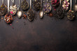Various tea in spoons. Black, green and red tea
