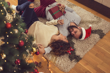 Wall Mural - Loving couple on Christmas morning