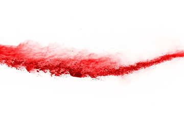 Wall Mural - freeze motion of red powder exploding, isolated on white background. abstract design of red dust clo