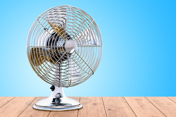 Poster - vintage table fan on the wooden table, 3d rendering