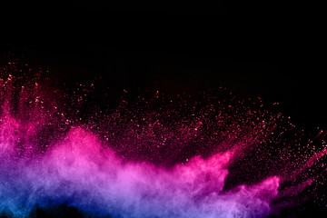 Wall Mural - abstract colored dust explosion on a black background.abstract powder splatted background,freeze mot