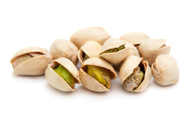 Wall Mural - heap of ripe roasted pistachio isolated on white background