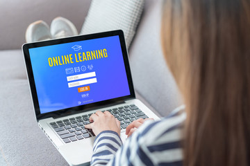 Poster - Close up back woman online learning log in on webpage with laptop at sofa in home,e-learning concept.digital lifestyle.