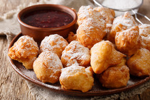 Albanian Food: Fried Donuts Are Served With Raspberry Jam And Powdered Sugar Close-up On A Plate. Horizontal