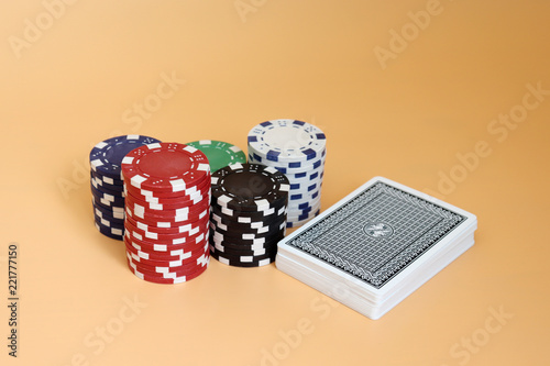 фотография The pile of casino chips and a pile of cards.