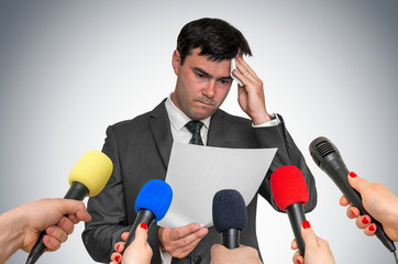 Nervous man is sweating, he afraid of public speech