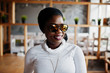 © AS Photo Family - African muslim girl in black hijab and sunglasses posed at modern cafe .