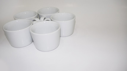 Wall Mural - White Ceramic cups or mugs on white back ground.