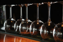 Wine Glasses Stand Upside Down On The Bar In The Restaurant, An Abstract Bar Image, An Image With Retro Toning