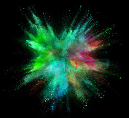 Wall Mural - Explosion of coloured powder isolated on black background.