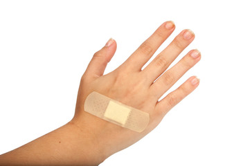 medical plaster or patch on hand isolated on the white