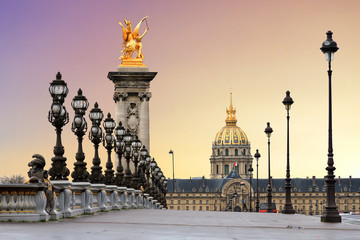 Beautiful sunrise at the Pont Alexandre III and Les Invalides in Paris