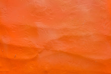 Rough Concrete Plaster Is Colored Orange, Texture For Background.