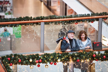Happy Senior Couple Doing Christmas Shopping Together.