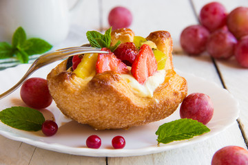 Delicious dessert with cream and fruit