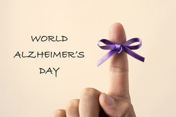 purple ribbon and text world alzheimers day