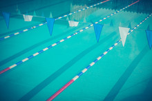 A Swimming Pool With Lane Dividers And Bunting