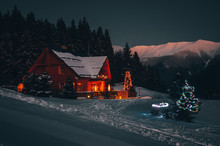 Christmas Cottage In Dark Winter Night In Mountains