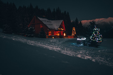 Christmas cottage in beautiful dark winter night