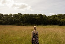 Woman Standing In The Field