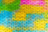 Fototapeta Młodzieżowe - Colorful painted brick wall texture background. Graffiti brick wall, colorful background.
