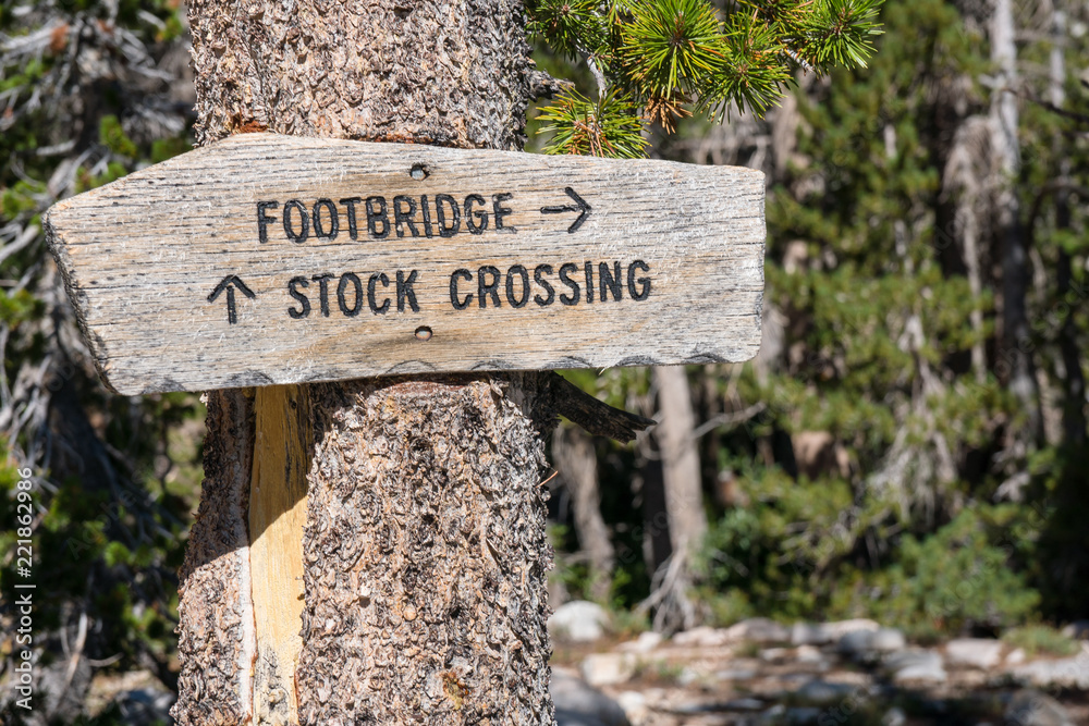 Wooden trail signs in the mountain backcountry of the Sierra Nevada in California