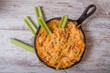 © nsc_photography - Flat lay of baked cheese dip in skillet with celery