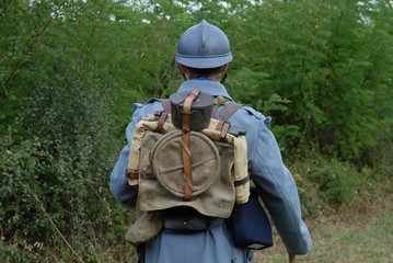 Wall Mural - back view of a 1918 French soldier in the countryside