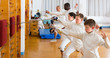 © JackF - Happy group of athletes at fencing workout