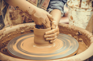 Hands of a potter at work