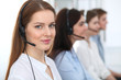 © rogerphoto - Call center. Beautiful cheerful smiling operator consulting clients with headset. Business concept of customer service