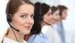 © rogerphoto - Call center. Beautiful cheerful smiling operator consulting clients with headset. Business concept of customer service