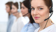 © rogerphoto - Call center. Beautiful cheerful smiling operator consulting clients with headset. Business concept of customer service
