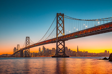 San Francisco skyline with Oakland Bay Bridge at sunset, California, USA