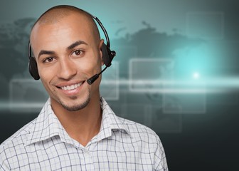 Wall Mural - Portrait of a smiling man with headset working as a call center