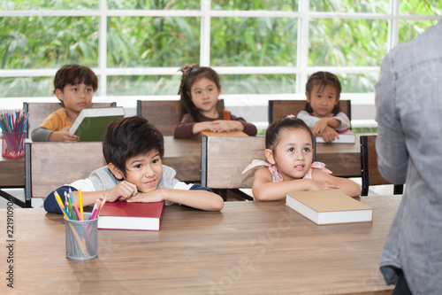 Group Of Cute Happy Little Child Student Leaning On Table With Cute Happy Little Child Student Leaning