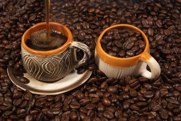 Coffee display in two cups on the table