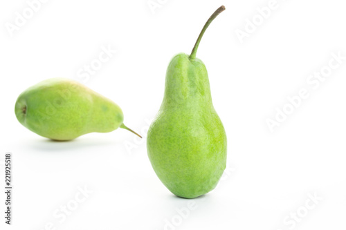 green ripe pear on white background