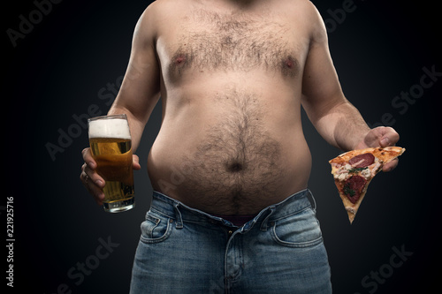 A Fat Man In Jeans With Saggy Fat On The Sides And A Hairy Belly