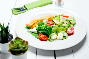 Canvas Print - Omelet with vegetables and cherry tomatoes