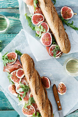 Poster - Sandwich prosciutto mascarpone cheese figs white wine top view