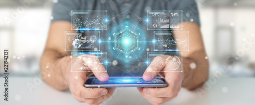 Cuadros en Lienzo Businessman using digital screens interface with holograms datas 3D rendering