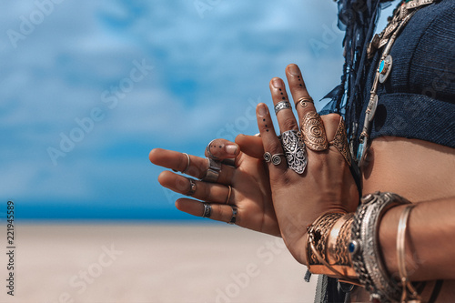 Plakat close up of stylish tribal dancer hands. woman in oriental costume outdoors