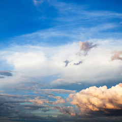 Wall Mural - white and pink cumuli clouds in dark blue sky