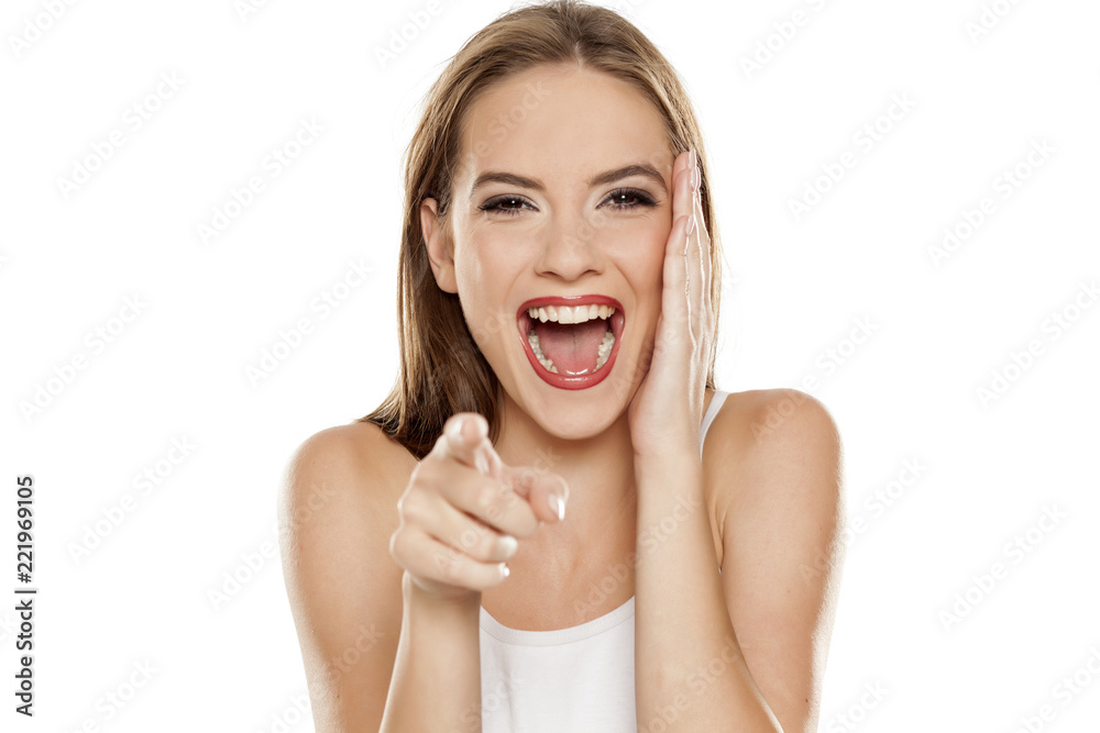 beautiful laughing girl on white background pointing on you Stock Photo |  Adobe Stock