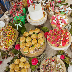 Candy Bar. Delicious sweet buffet with cake. Celebratory table. 