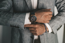 Businessman Luxury Style. Men Style.closeup Fashion Image Of Luxury Watch On Wrist Of Man.body Detail Of A Business Man.Man's Hand In A Grey Shirt With Cufflinks In A Pants Pocket Closeup. Toned