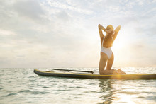 Miami Woman On A Paddle Board Enjoying The Sunrise