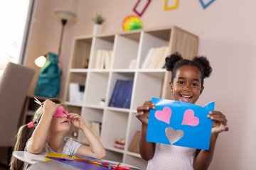 Wall Mural - Little girls cutting colorful papers